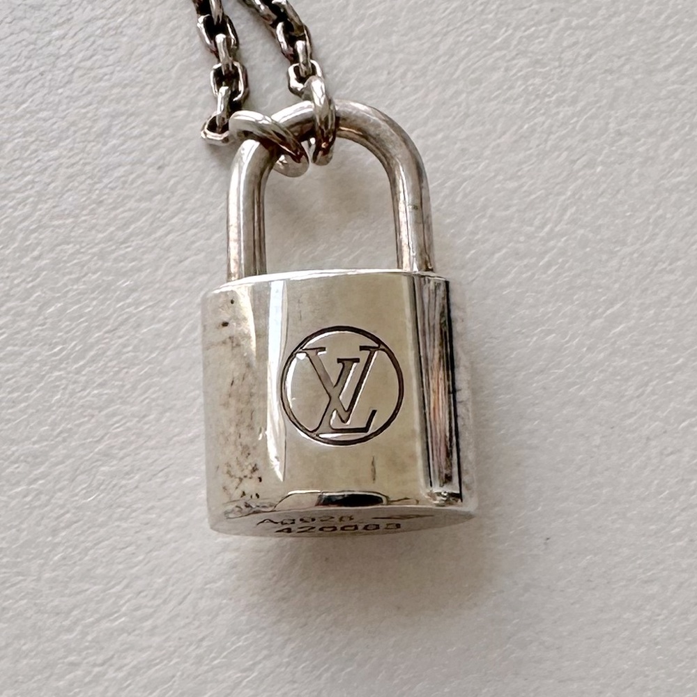 LOCKIT Louis Vuitton UNICEF necklace.